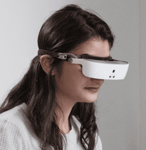 Woman wearing eSight electronic glasses for low vision enhancement